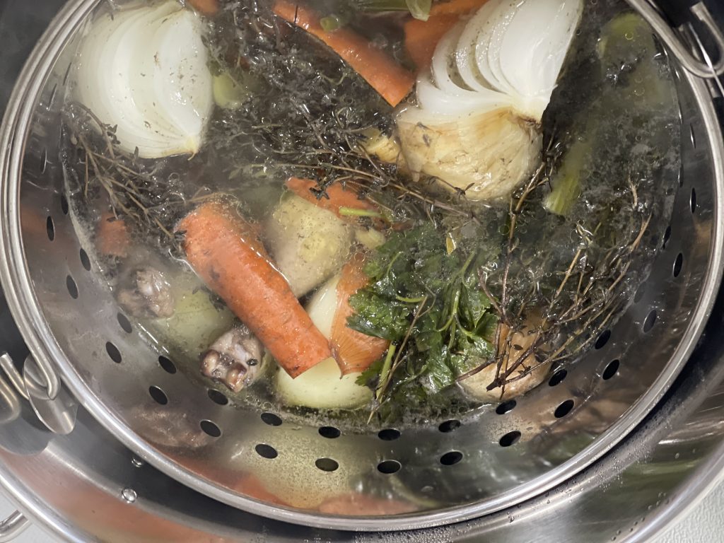 Broth simmering in pot - Fluffy Butt Farms